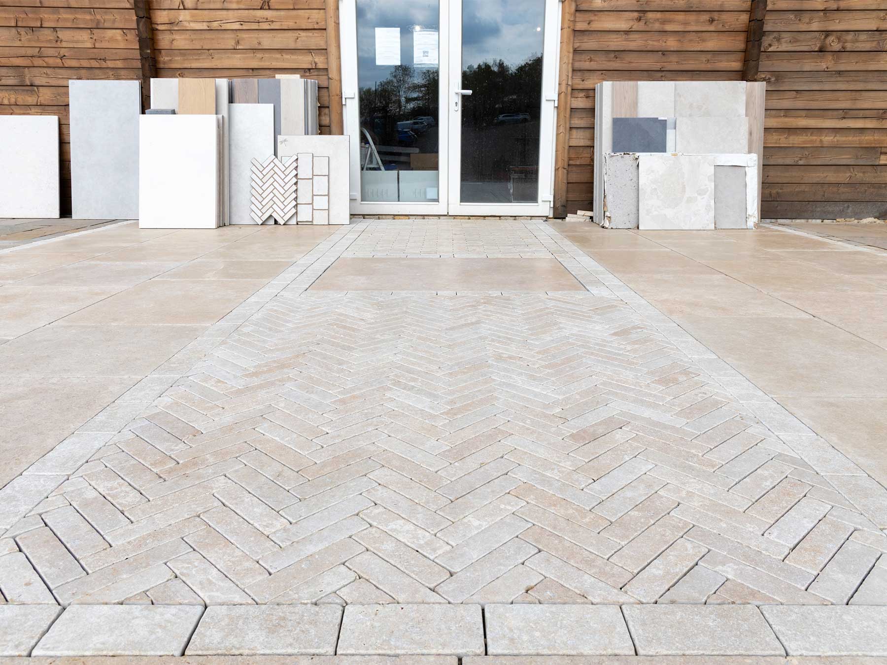 Sanai Pearl limestone paving and edging stones installed at the entrance to the Love Stone paving display area in Ewshot