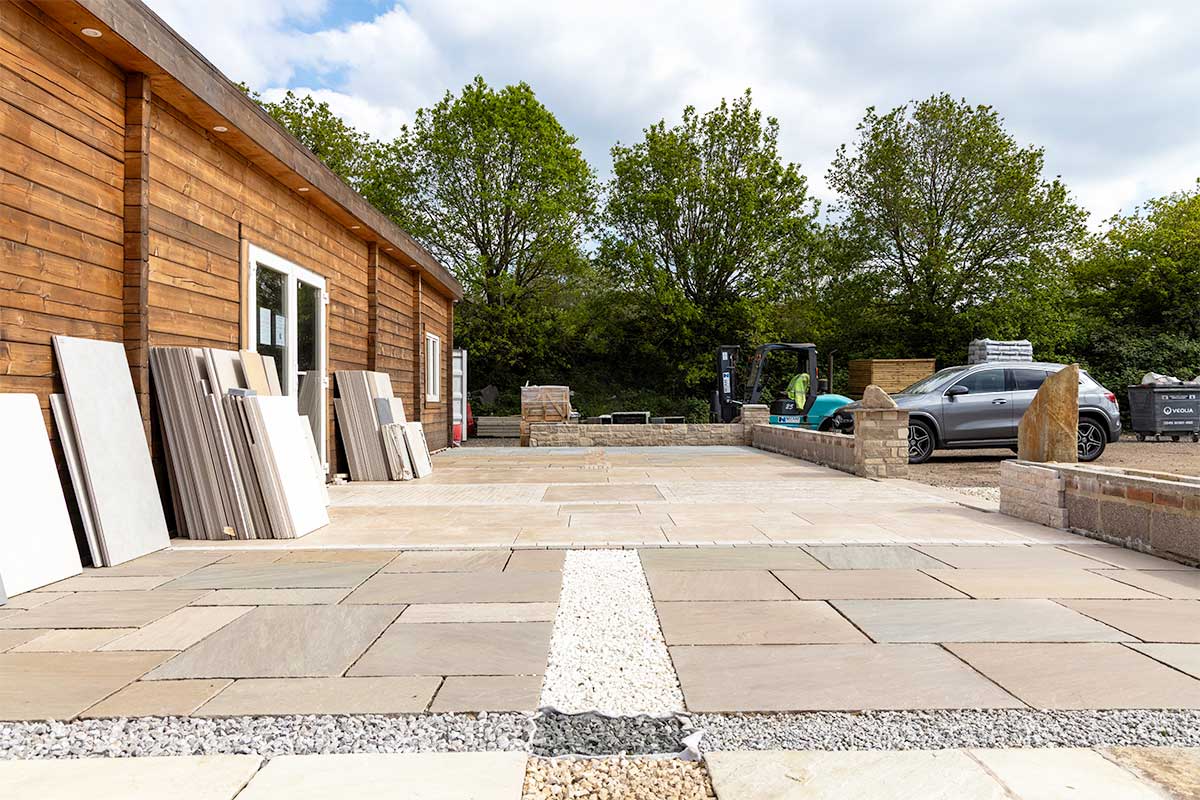 Installed natural stone paving displays outside the showroom at Love Stone in Ewshot, Hampshire