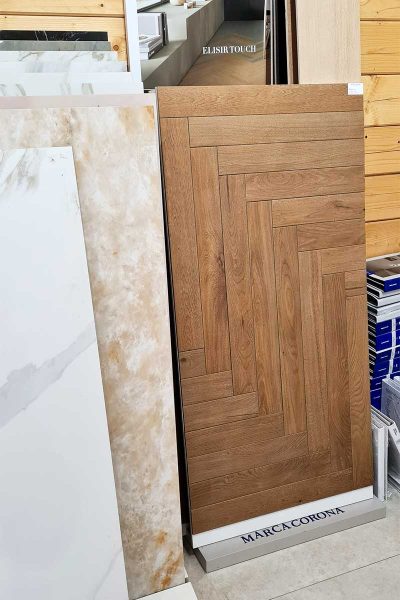 A selection of stone, porcelain, and wood effect porcelain tiles on display in the showroom at Love stone in Ewshot near Farnham